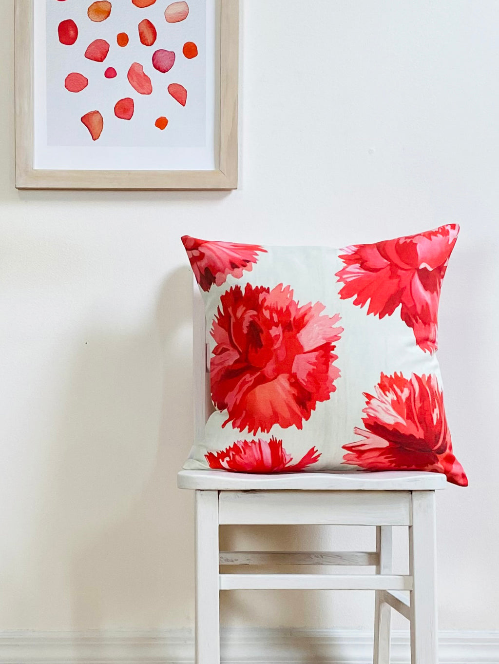 Throw Pillow: Red Carnations on Snow